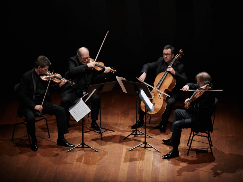 Photo of the Silesian String Quartet on the stage of the NOSPR chamber hall