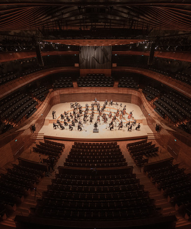 orchestra and conductor on stage at the NOSPR concert hall