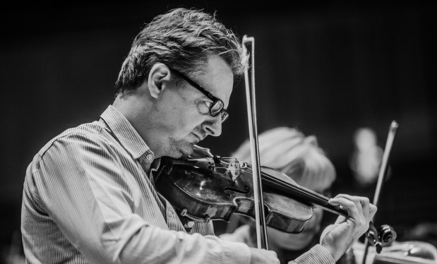 concertmaster Piotr Tarcholik with violin